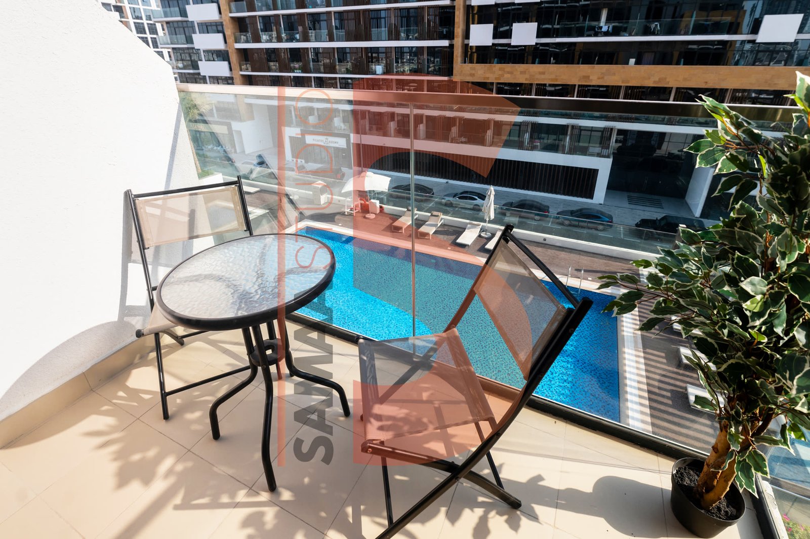 Real estate — balcony with pool view, UAE apartment